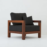 profile of Cali teak armchair with coal cushions
